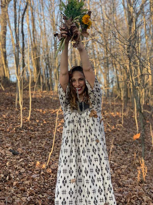 Lara-Land-holding flowers and walking in the woods