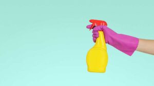 Yellow Spray bottle on a Turq background